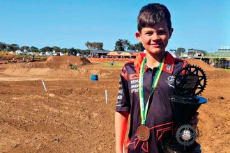 Jake Knighton is proud of his third place in the 65cc class.