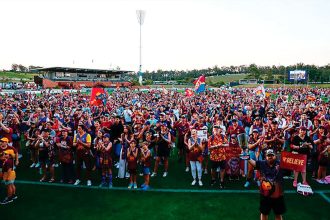 LOYAL FANS: Excited Lions supporters celebrate the win with their heroes.