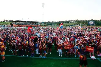 LOYAL FANS: Excited Lions supporters celebrate the win with their heroes.