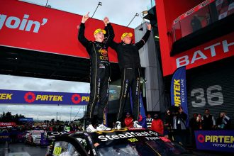 Matt Payne of Grove Racing celebrates with co-driver Garth Tander after winning the Supercars Championship Bathurst 1000 at Mount Panorama Circuit earlier this month. PHOTO: AAP Image/Dan Himbrechts
