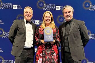 Nicholas Street Precinct Director James Hepburn and Mayor Teresa Harding accept the award from Buchan Director Phil Schoutrop.