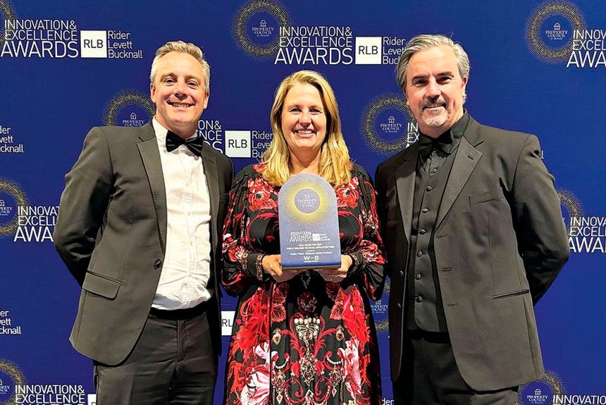 Nicholas Street Precinct Director James Hepburn and Mayor Teresa Harding accept the award from Buchan Director Phil Schoutrop.