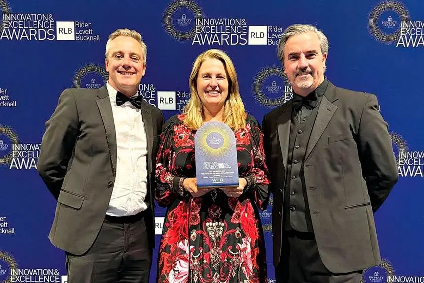 Nicholas Street Precinct Director James Hepburn and Mayor Teresa Harding accept the award from Buchan Director Phil Schoutrop.