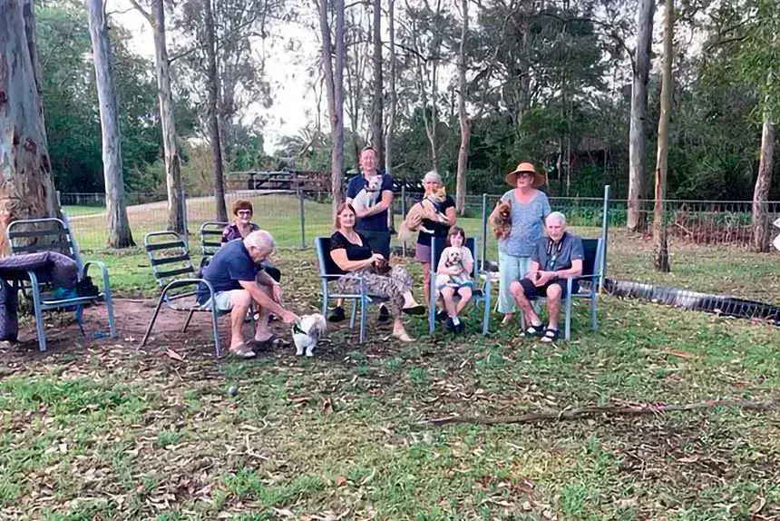 BYO CHAIRS: A group of frustrated Camira dog lovers in their local dog park, and the trees in question.