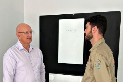 BRIGHT SUCCESS: Federal Member for Blair Shayne Neumann chats with Fallon Solutions technician Jade as he installs a solar battery.