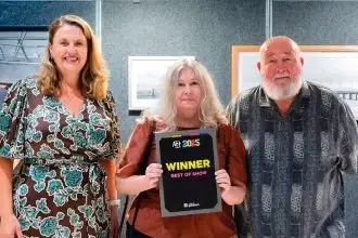 WINNING FEELING: Artist Anne Toovey accepts the Best of Show award from Mayor Teresa Harding and Ipswich Arts Advisory Group member Wayne McDonnell.
