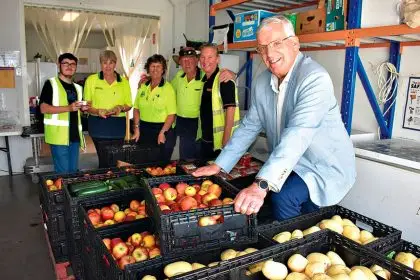 FEEDING THE NEEDY: Fred Muys and workers at the food co-op at the Tivoli Drive In site. The reclaimed food operation will remain open five days a week.