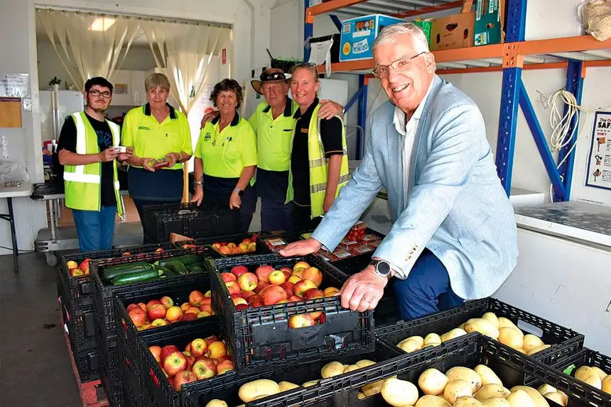 FEEDING THE NEEDY: Fred Muys and workers at the food co-op at the Tivoli Drive In site. The reclaimed food operation will remain open five days a week.