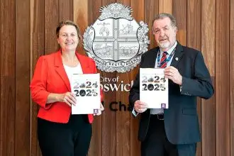 Mayor Teresa Harding and Finance and Governance Committee Chairman Paul Tully receive the Annual Report.