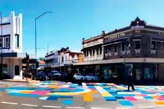 BRIGHT IDEA: The colourful geometric design originally proposed for the intersection. INSET: Our report on the proposed design in last week’s Local Ipswich News highlighting opposition.