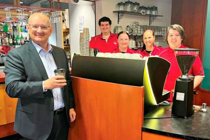 TOP MARKS: Shayne Neumann enjoys a coffee made by TAFE students.