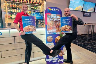 Club Services Ipswich staff Morgan Andrew and Brett Cruice celebrate selling a winning Keno entry.