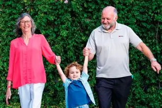 Jan and Laurie Mundt with their grandson.