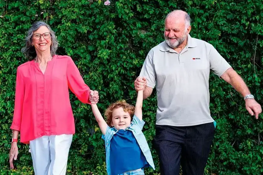 Jan and Laurie Mundt with their grandson.