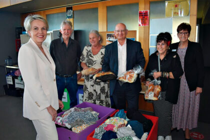 FIRST-HAND VIEWING: Tanya Plibersek visits the Leichhardt-One Mile Community Centre food and clothing centre with (from left) Riverview Neighbourhood House president Gregory Broad and co-ordinator Christine MacDonald, Blair MP Shayne Neumann, Leichhardt centre co-ordinator Kym Tuuta, and Ipswich West MP Wendy Bourne.