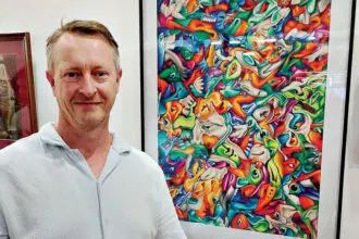 Artist Kevin Saunders at the On Paper exhibition.