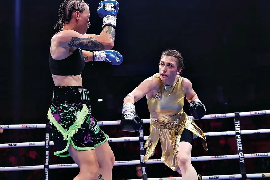 ALL ACTION: World champion Elif Nur Turhan storms forward against Ipswich’s Taylah Gentzen in their world title bout in England. PHOTO: Mark Robinson – Matchroom Boxing
