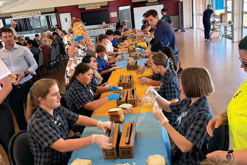 MANY HANDS: The program now delivers more than 6100 sandwiches each session to 31 schools across Ipswich.