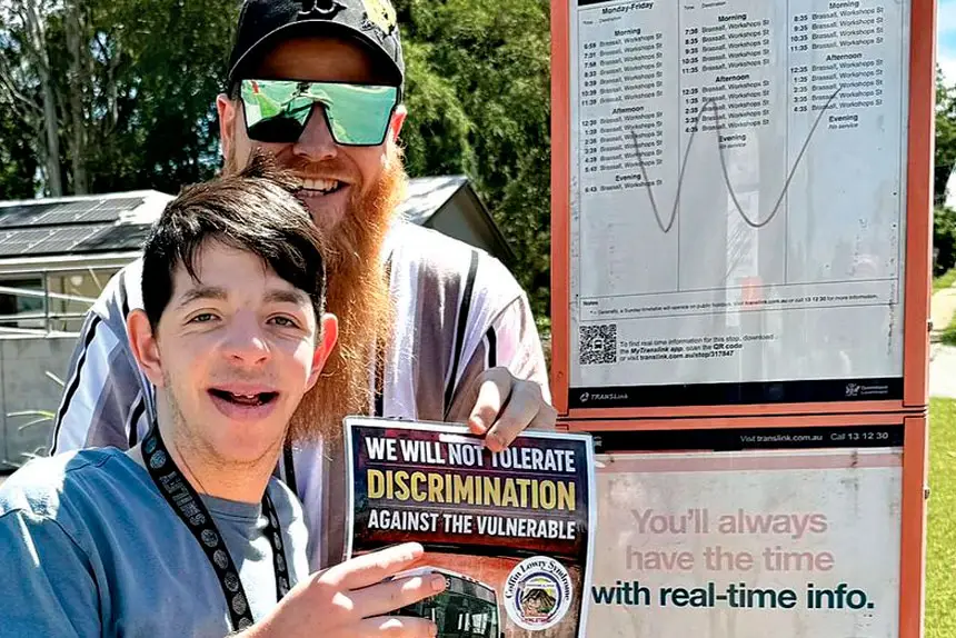 TAKING ACTION: Rhyley Schultz is placing posters at city bus stops.