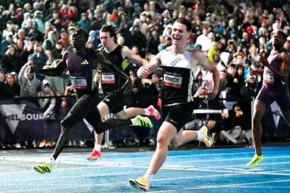 Gout Gout just fails to haul in Lachlan Kennedy. PHOTOS: AAP IMAGE