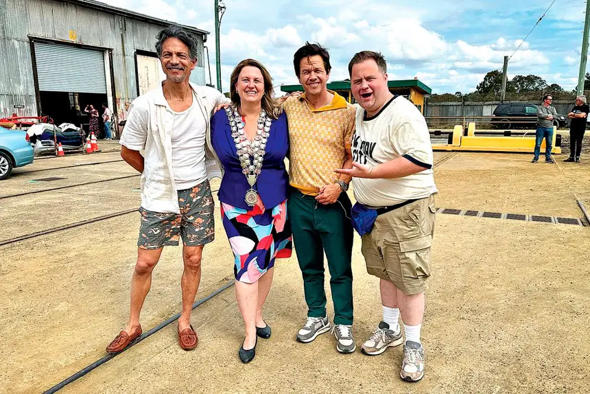 STAR POWER: Mayor Teresa Harding with Benjamin Bratt, Mark Wahlberg and Paul Walter Hauser.