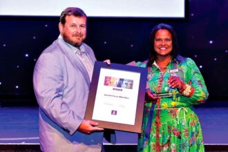 GREAT SUCCESS: Ipswich State High School teacher and coach Chris Riches with Cr Pye Augustine.