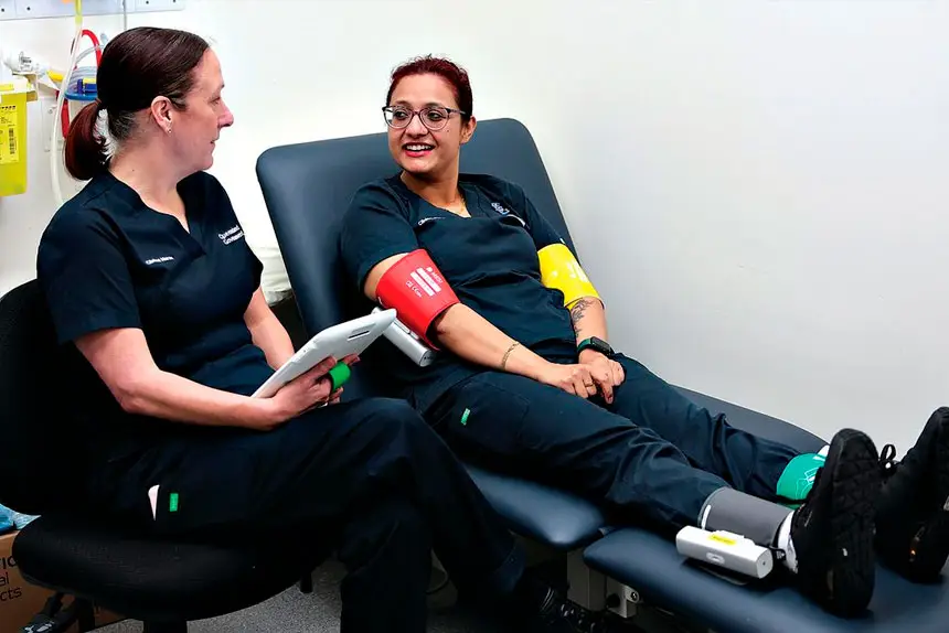 West Moreton Health staff members Michelle West, left, and Anjana Neupane –who is modelling the MESI mTABLET Ankle Brachial Index (ABI) device.