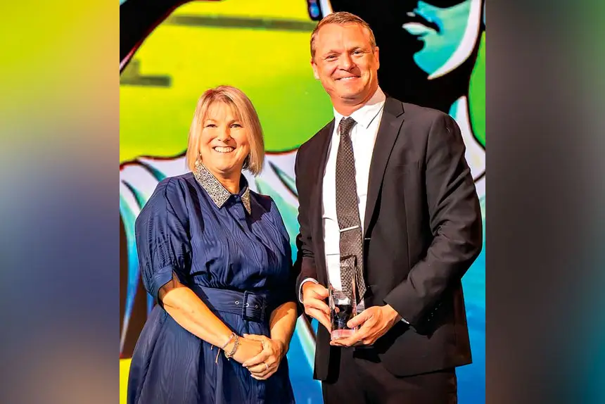 GREAT LEADER: Proud principal Brendan Krueger with his award.
