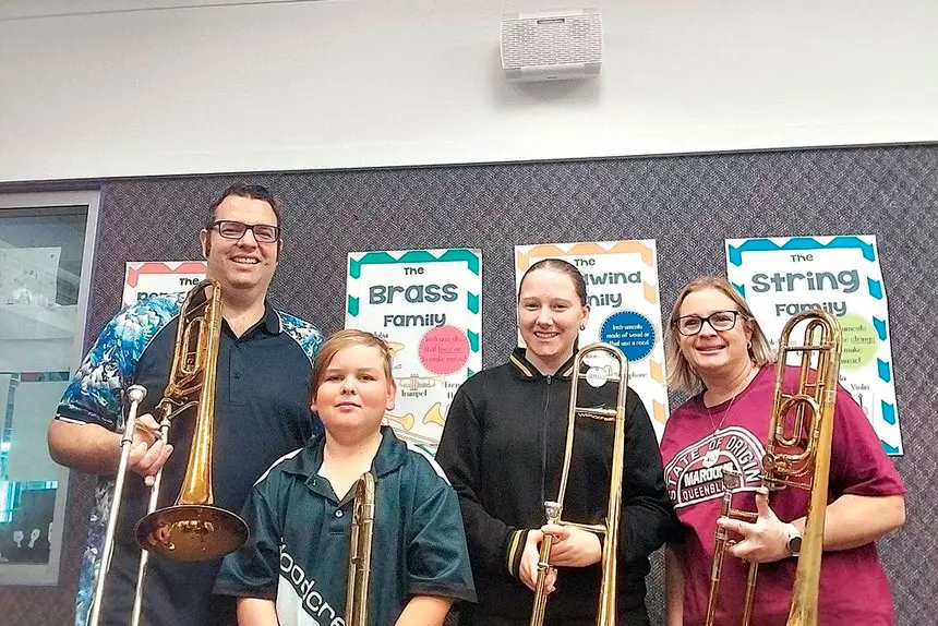 Event organiser Matt Chambers with Woodcrest students Holly and Indy, and instrumental teacher Shannon Druery.