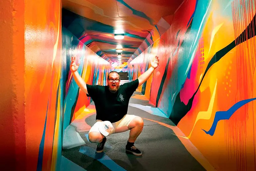 TUNNEL VISION: Matt Tervo in High Street Tunnel, Toowong, painted by Sofles and Drapl for Brisbane City Council. Having previously spent $25,000 per year to remove graffiti, Council employed the artists to use recycled paint to deliver an immersive public art piece.