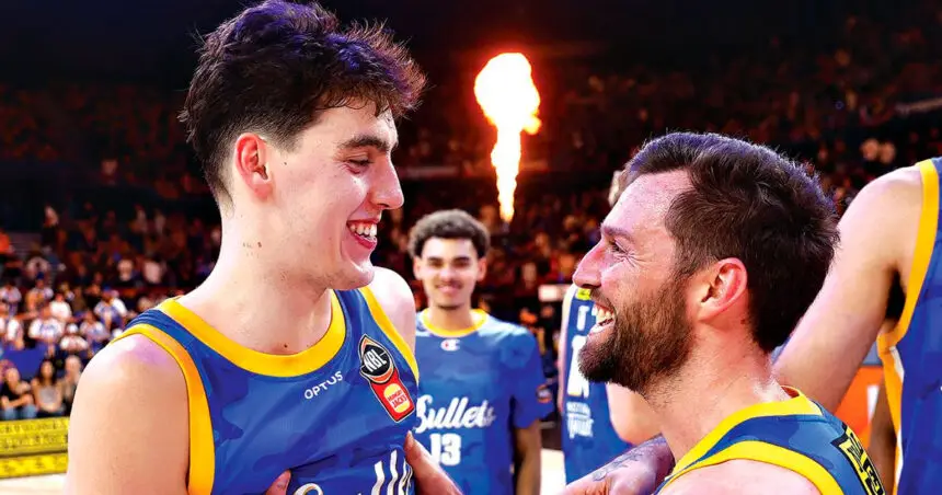 Max Mackinnon celebrates with 400-gamer Mitch Norton.